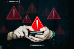 smartphone with multiple red warning icons displayed, symbolizing potential data breaches or cybersecurity alerts as featured on cloxmagazine